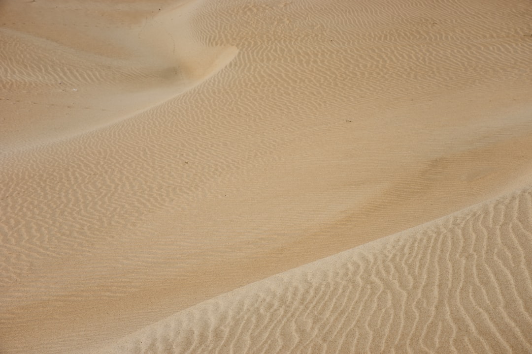 white sand with shadow of person