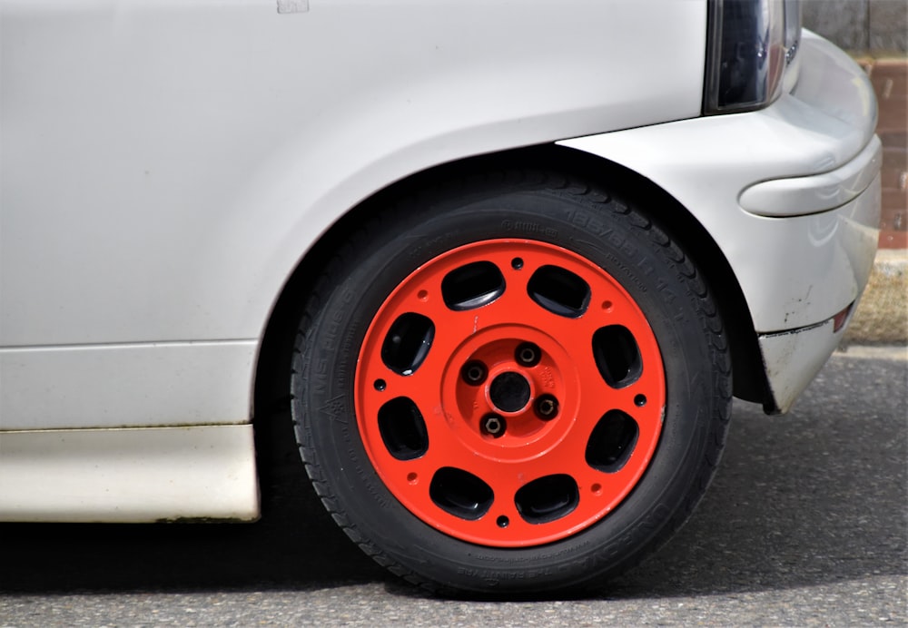 white car with red wheel