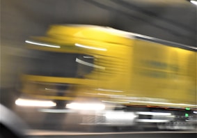 yellow car on the road