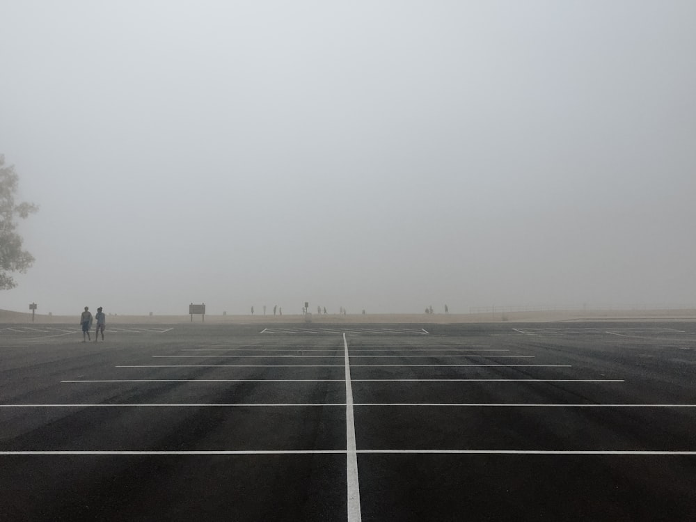 black asphalt road under white sky during daytime