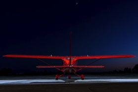 red and white plane on the sky
