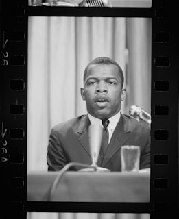 A professional lawyer speaking at a conference event.