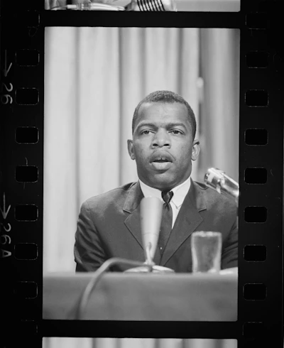 A professional interpreter speaking into a microphone at a conference.