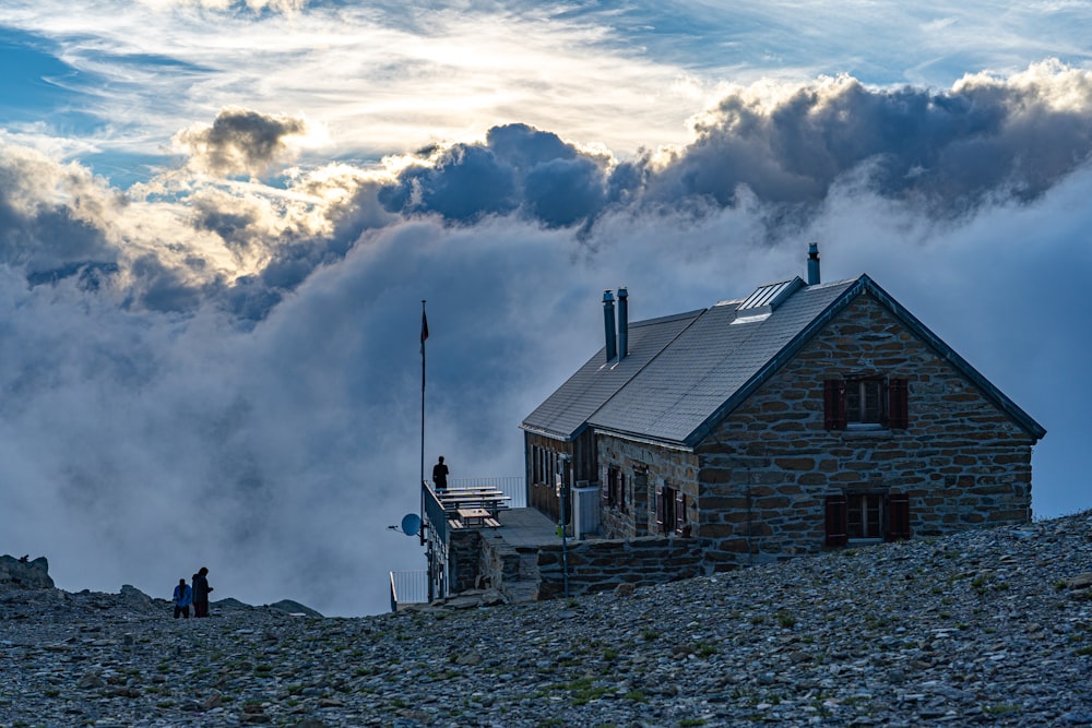 brown wooden house under white clouds during daytime