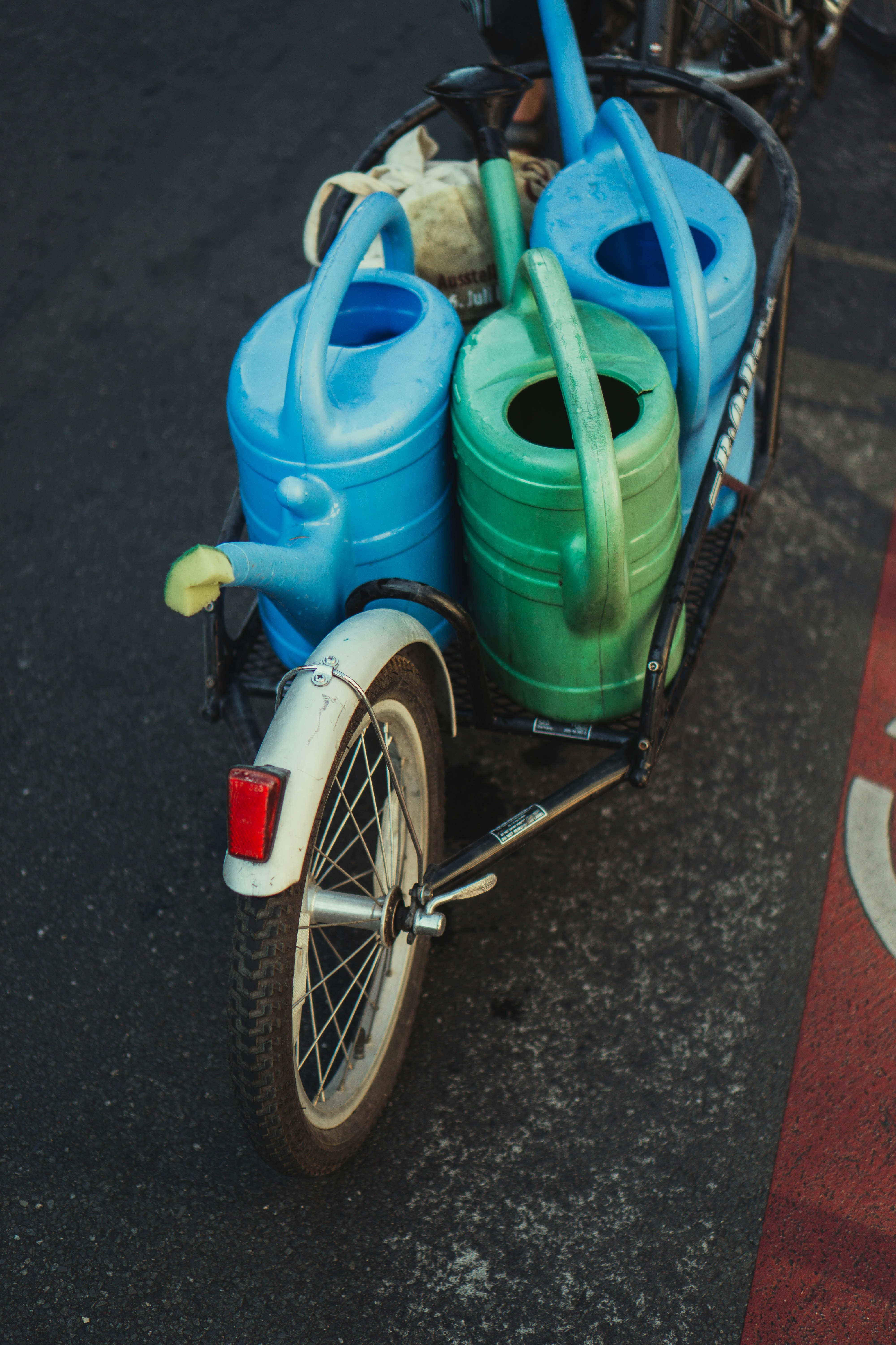 blue plastic water jug beside blue plastic water jug