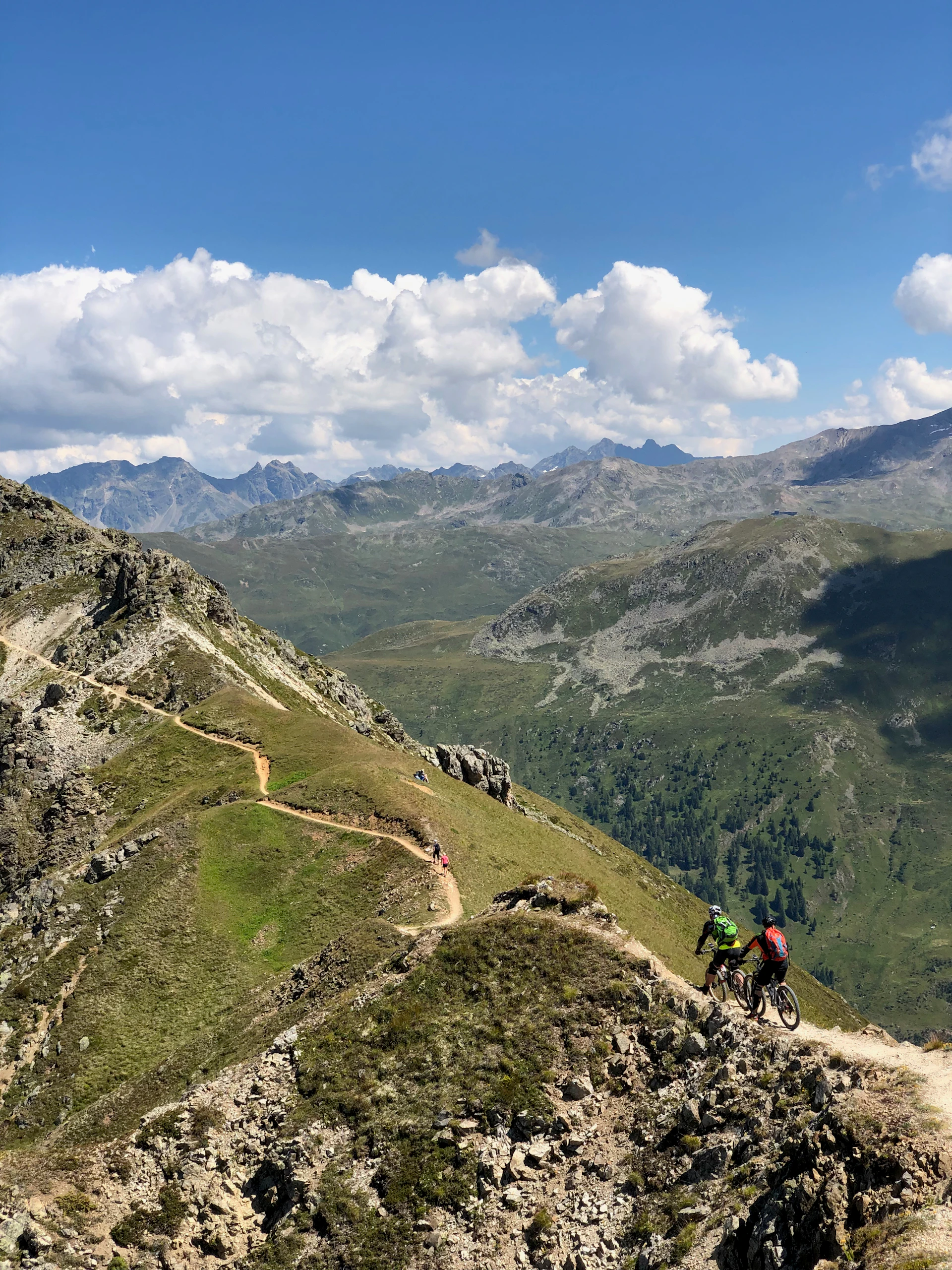 woman wearing yellow long-sleeved dress under white clouds and blue sky during daytime