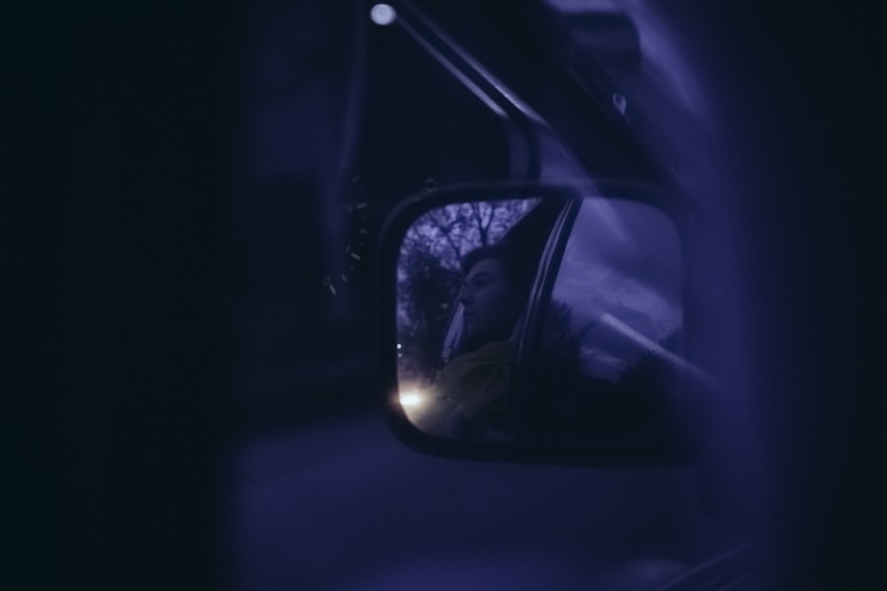 car side mirror with reflection of light