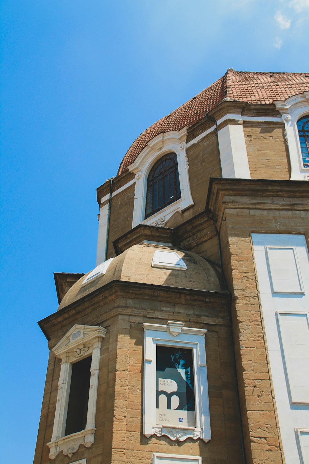 brown concrete building under blue sky during daytime