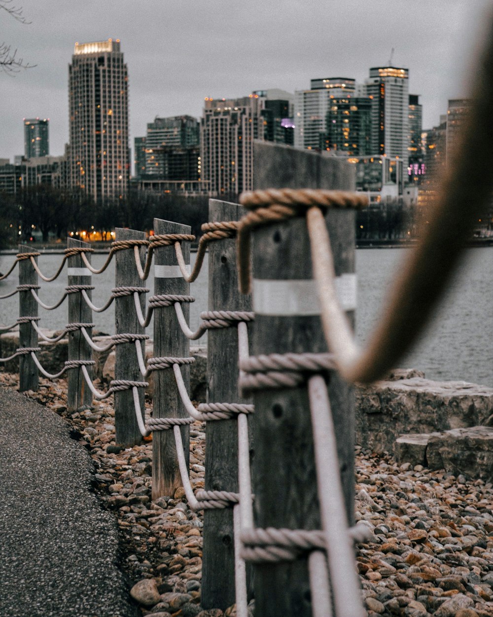 gray metal chain link fence near city buildings during daytime