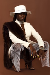 man in white blazer and black and white polka dot pants