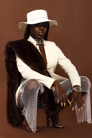 man in white blazer and black and white polka dot pants