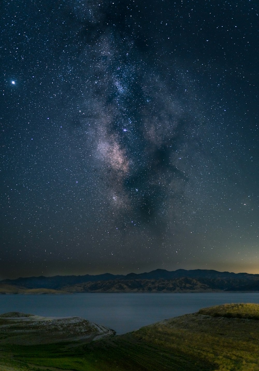 body of water under starry night