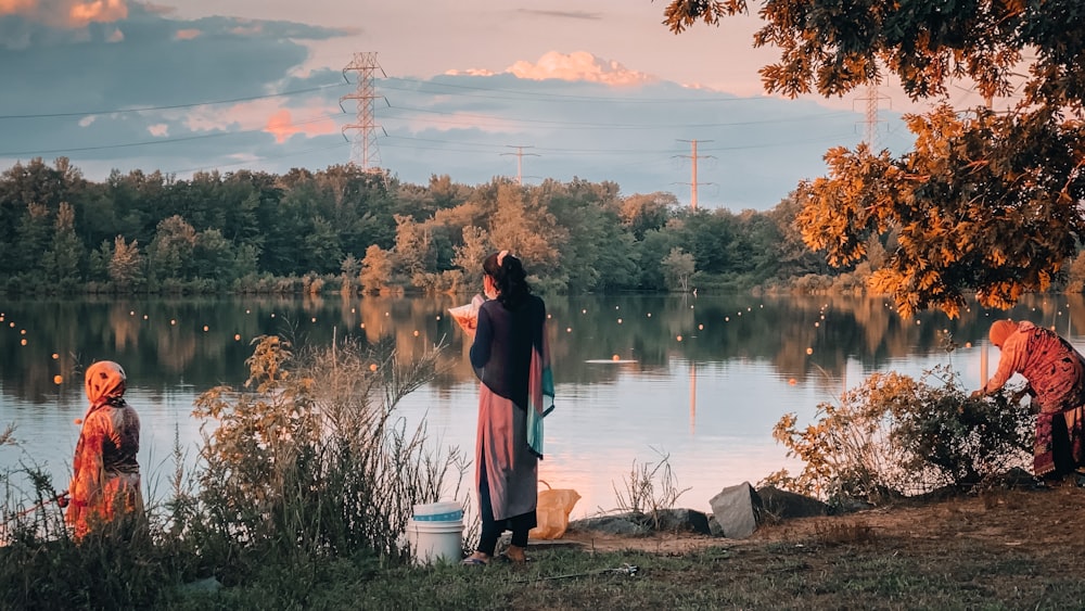 couple standing near lake during daytime