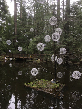 A vibrant scene of a glowing forest with friendly animals gathered around a sparkling tree.