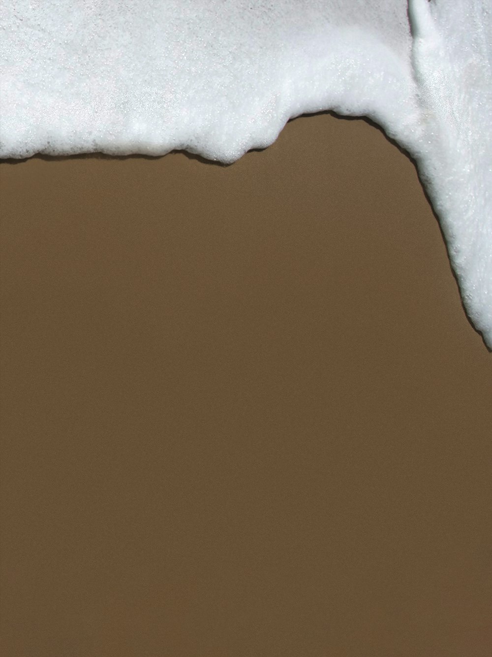 white textile on brown wooden table