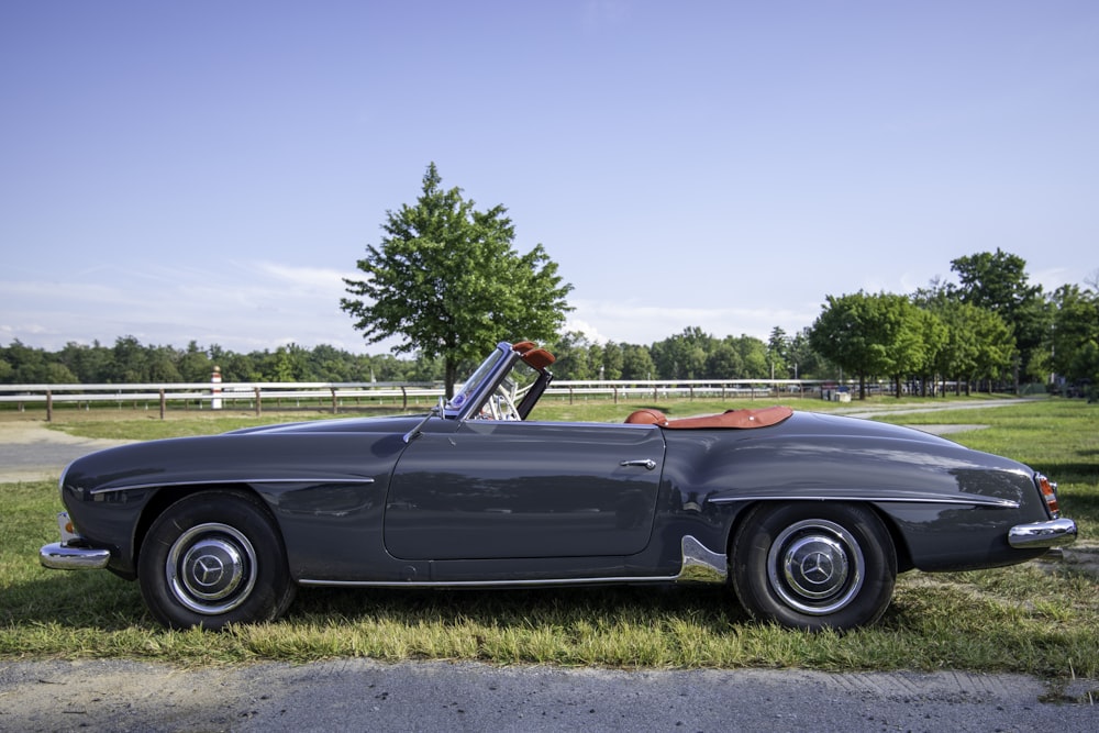 black convertible car on road during daytime