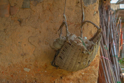 A rustic basket filled with freshly made cow dung cakes, showcasing their natural texture.