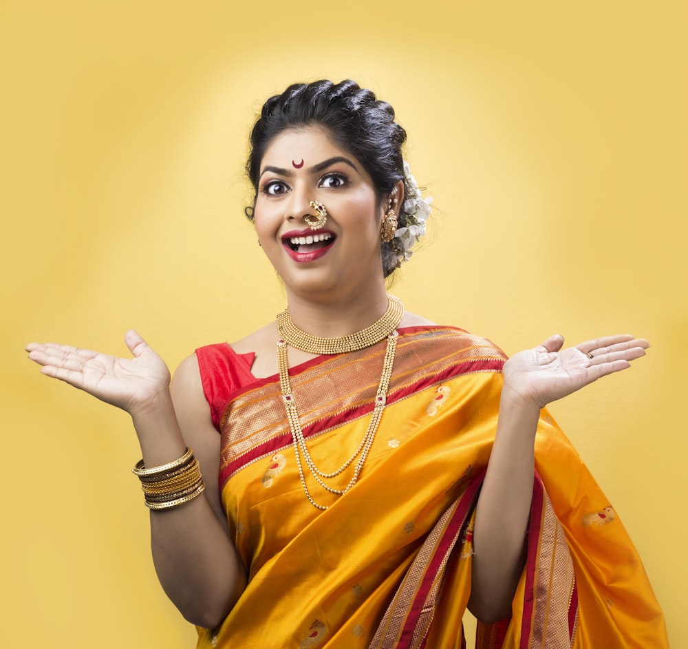 woman in yellow and red sari dress