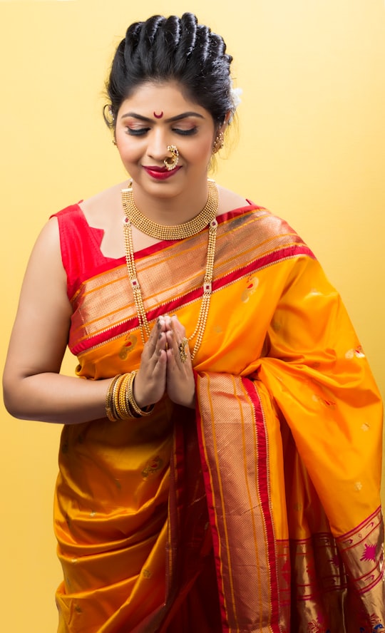 woman in yellow and red sari in Nagpur India