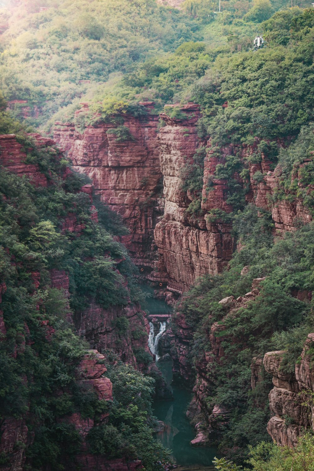 green and brown mountain with river