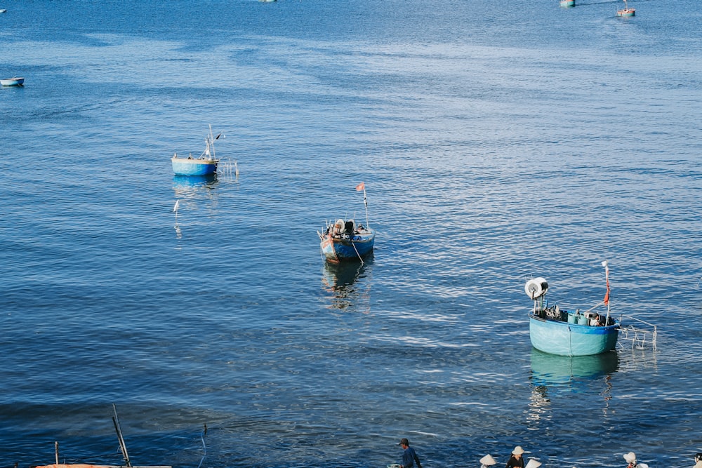 people in boat on sea during daytime