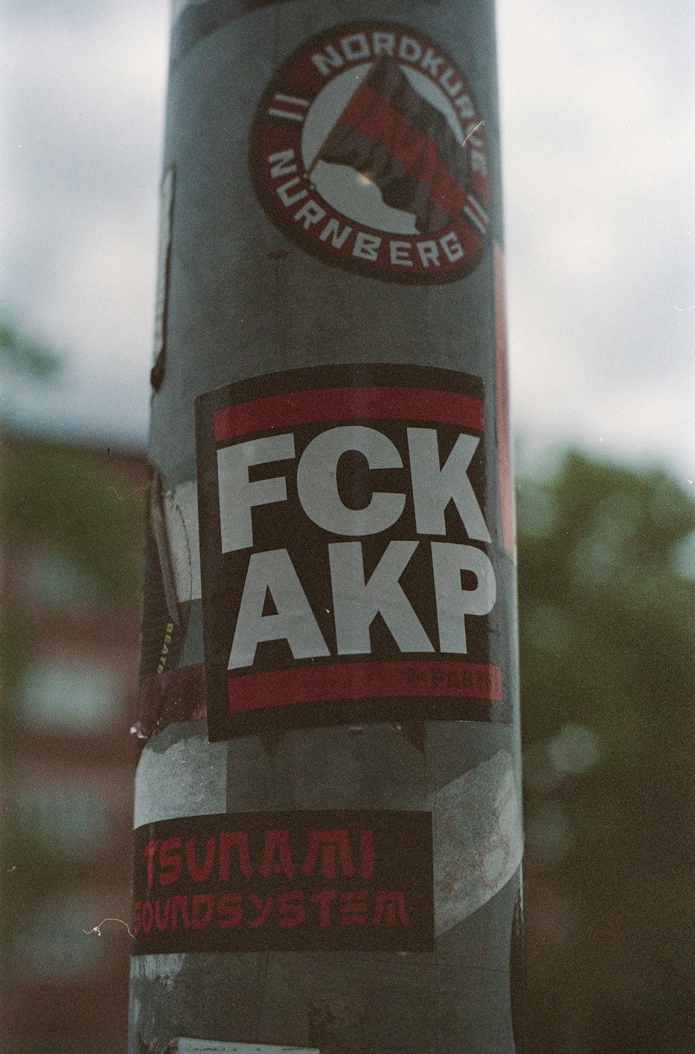 a sticker on a pole that says fck akp