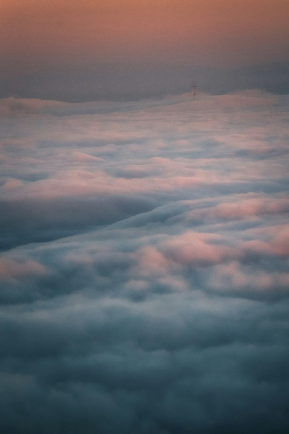 white clouds over mountains during daytime