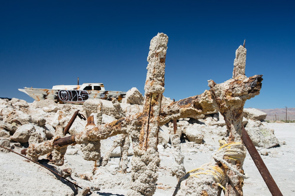 white car on rocky mountain under blue sky during daytime