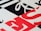 Geometric pattern with bold typography featuring overlapping black, white, and red letters. The design includes diagonal and horizontal lines creating a modern and abstract visual.