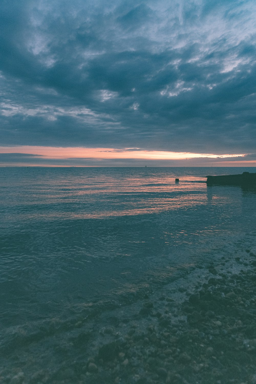 sea under blue sky during daytime