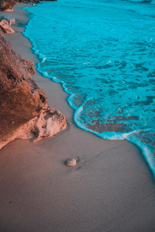 brown sand beach with brown rocks in Kish Iran
