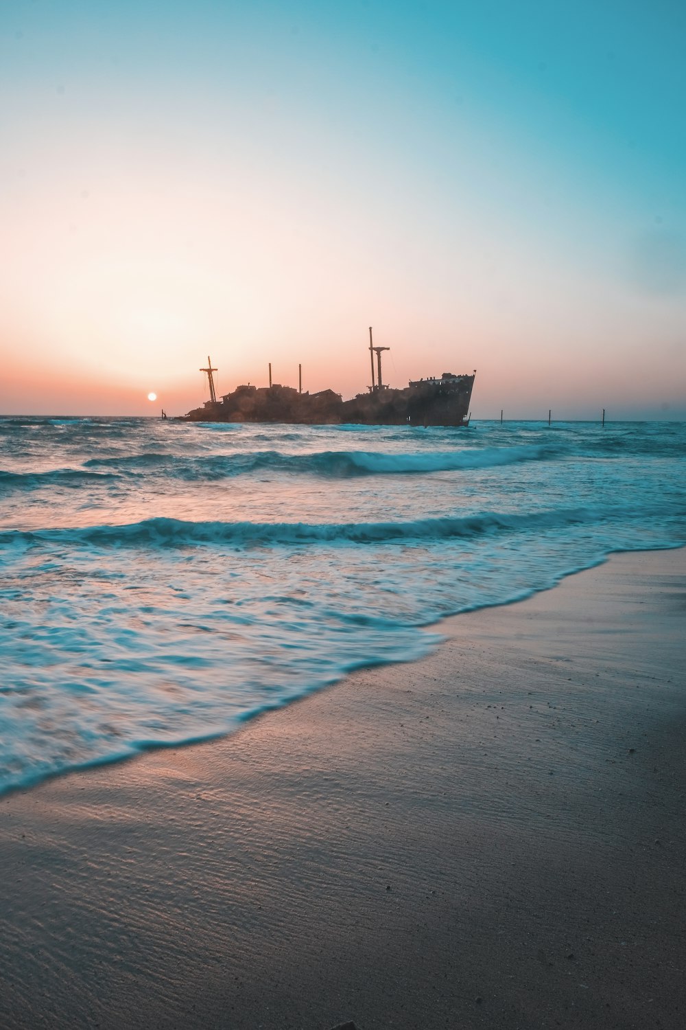 brown ship on sea during daytime