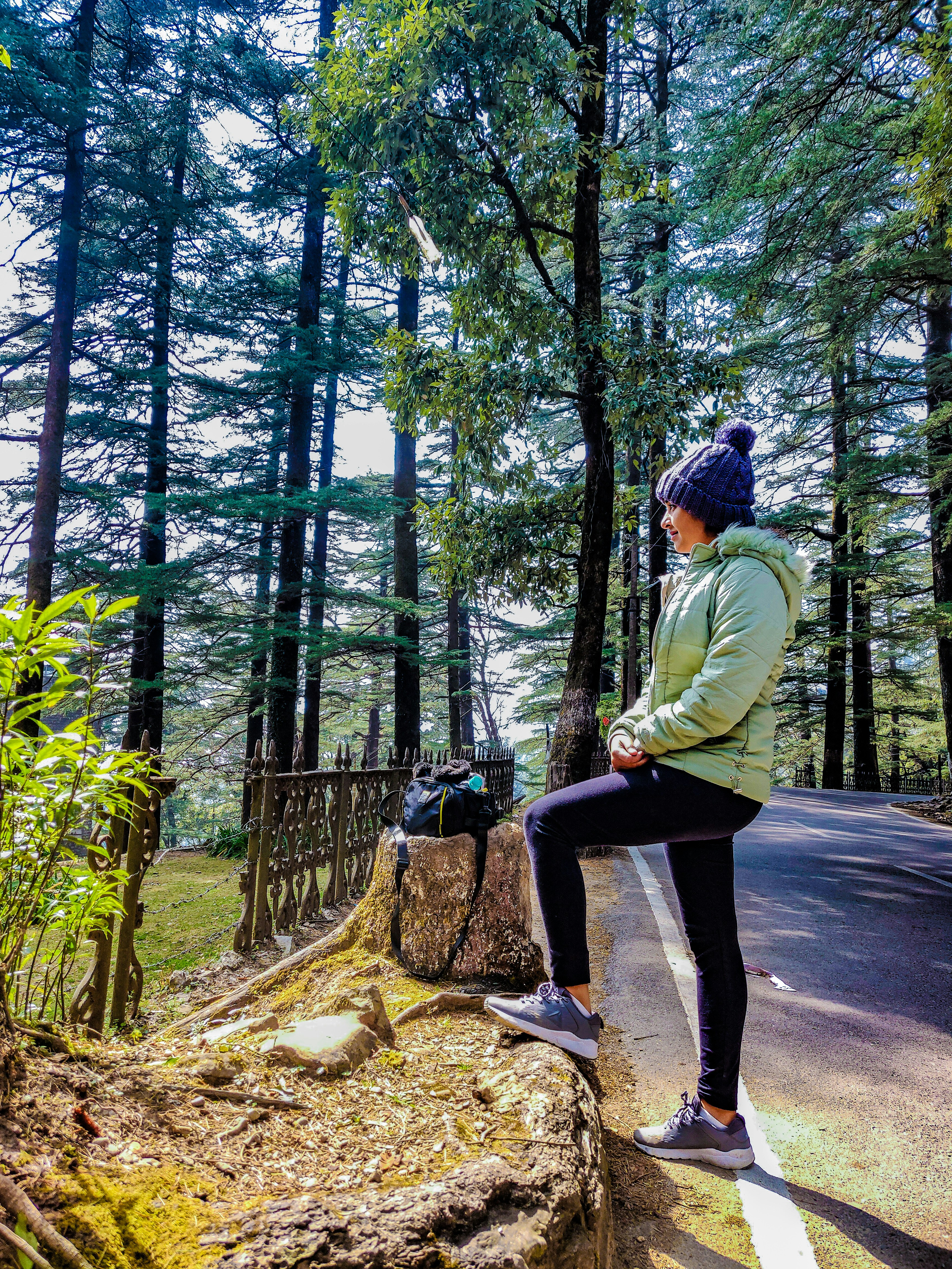 A girl standing on the trekking path