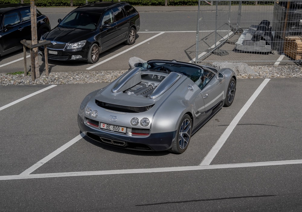 a silver sports car parked in a parking lot