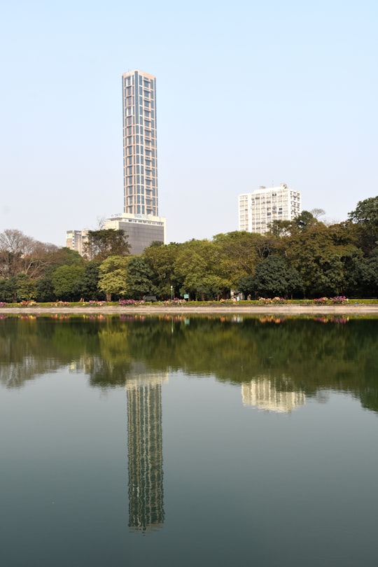 body of water near trees and buildings during daytime in Maidan India