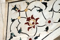 A beautifully arranged collection of marble inlay work showcasing floral designs.