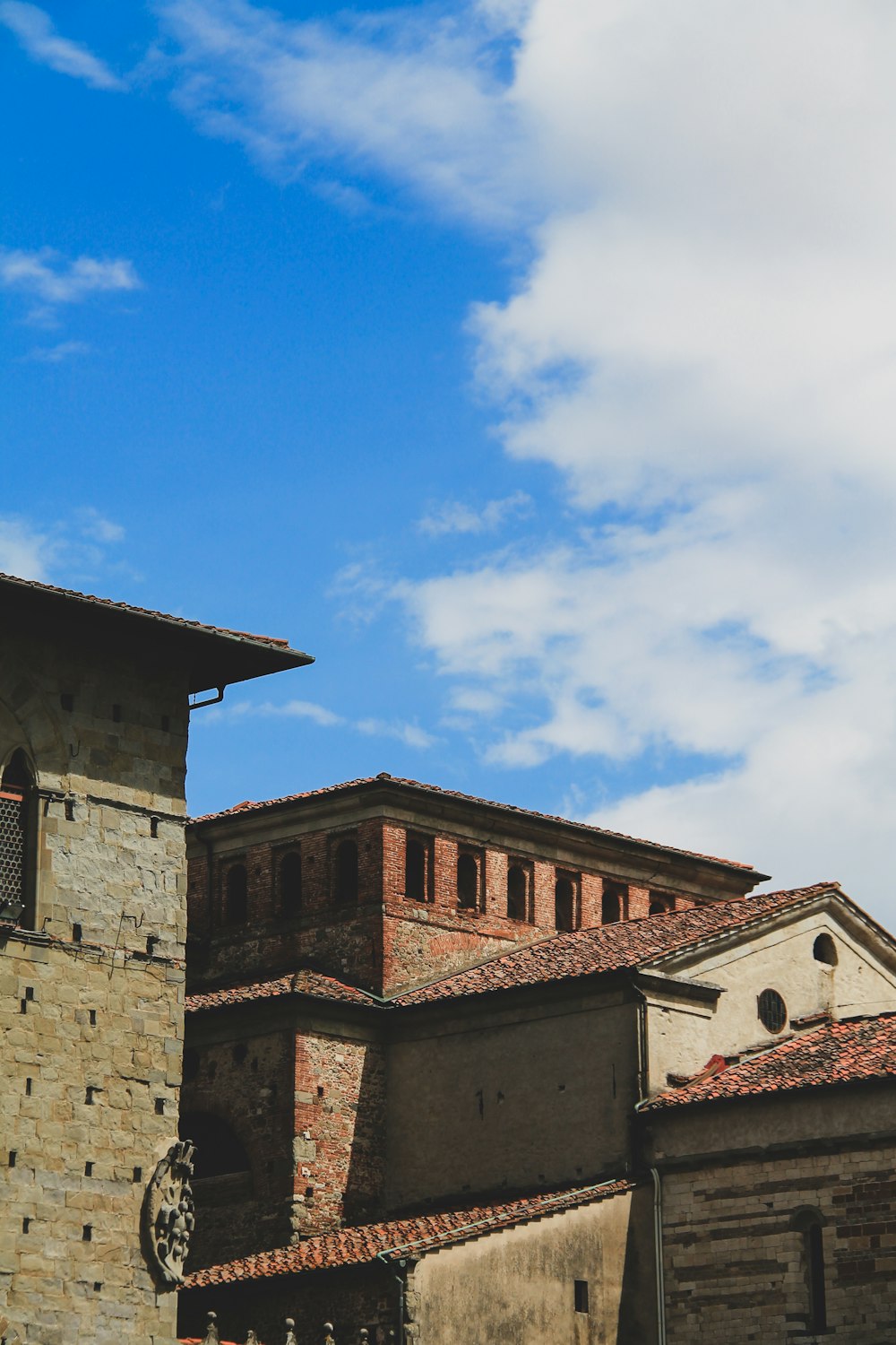 brown brick building under blue sky during daytime