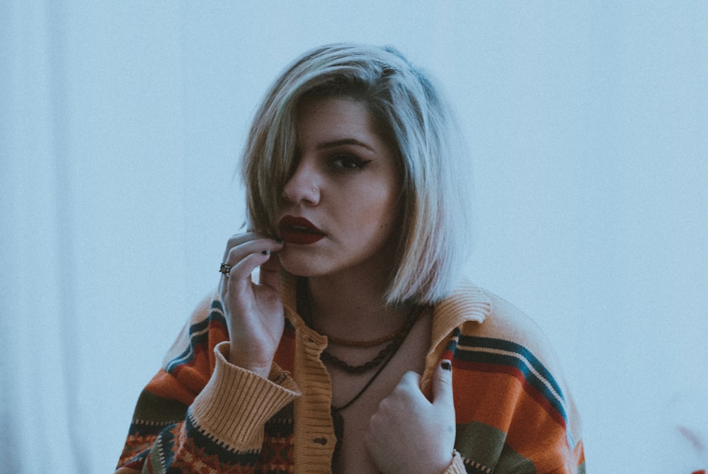 woman in white red and black sweater