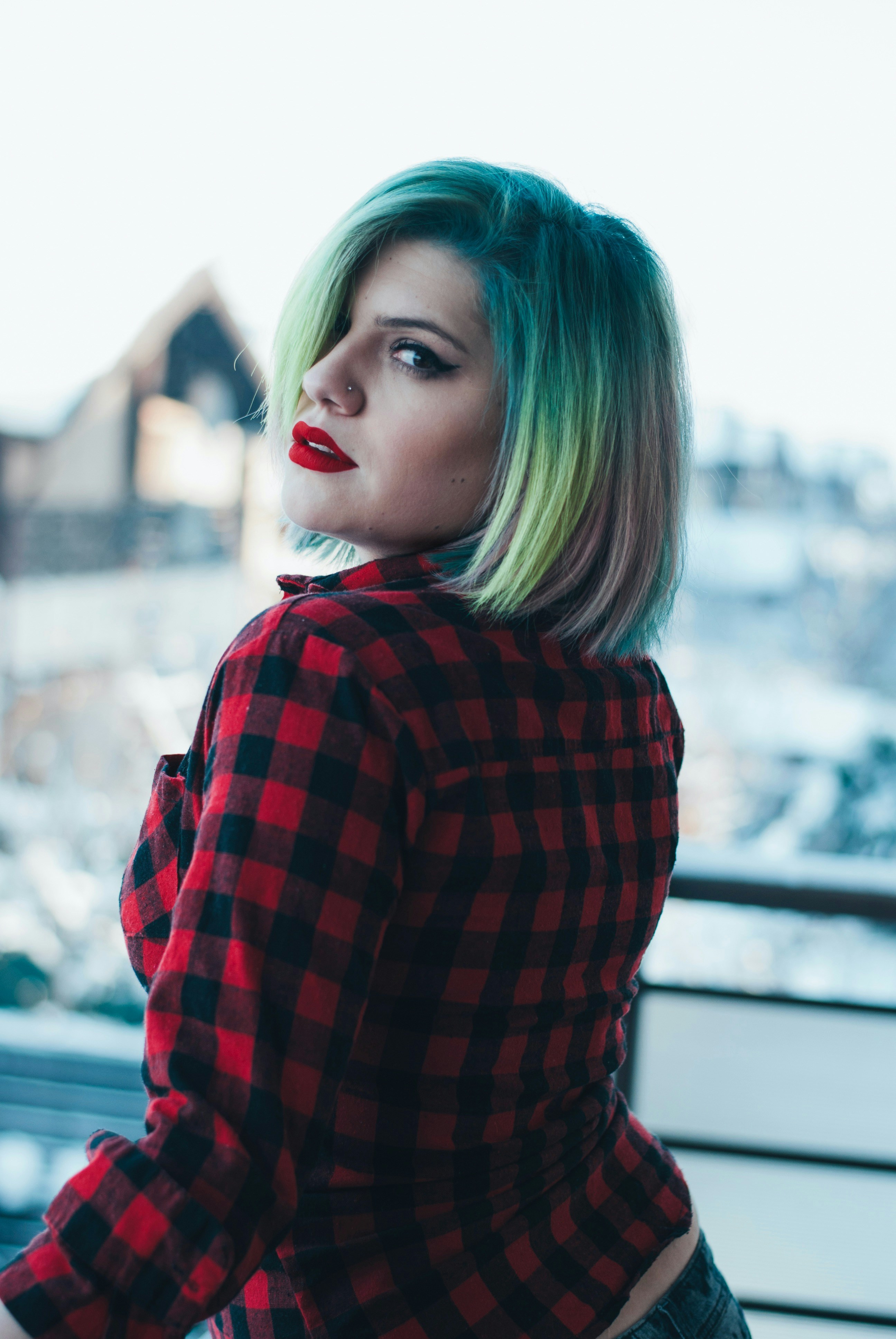 woman in red and black checkered dress shirt