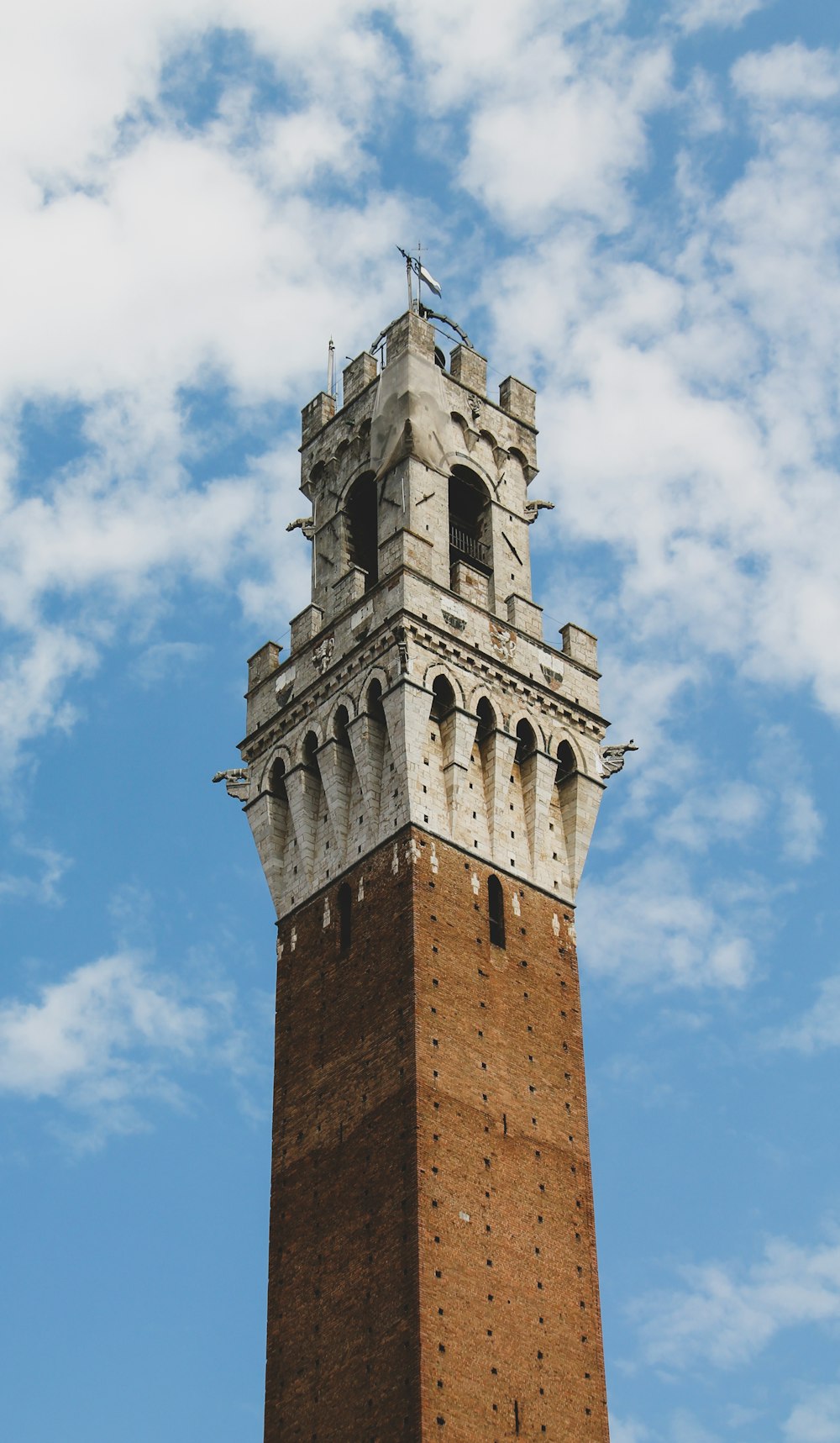 brown concrete tower under blue sky during daytime