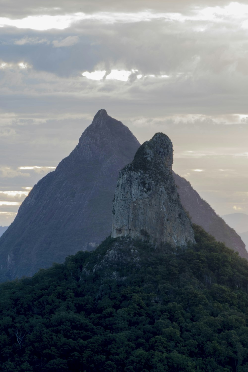 gray rock formation under white clouds during daytime