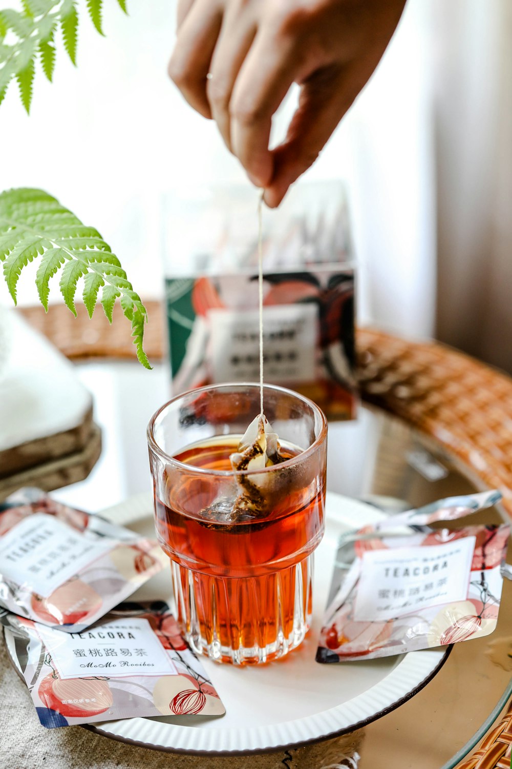 clear drinking glass with brown liquid