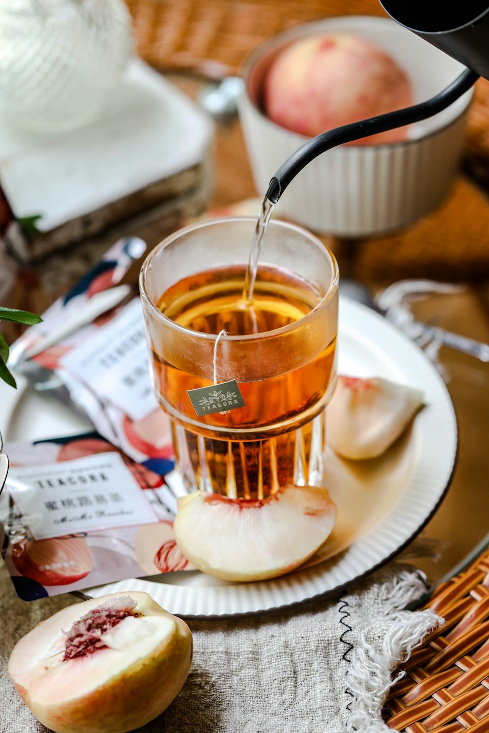 clear glass cup on white ceramic saucer