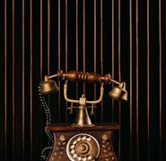 black and gold rotary phone