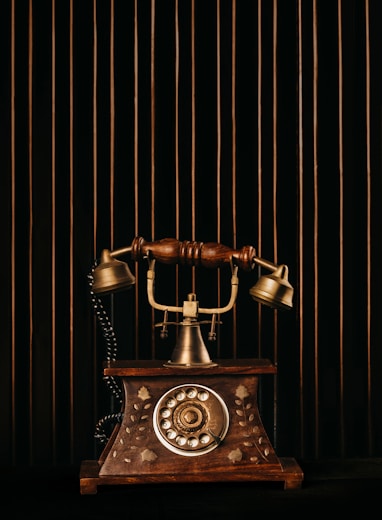 black and gold rotary phone