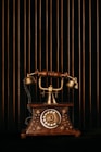 black and gold rotary phone