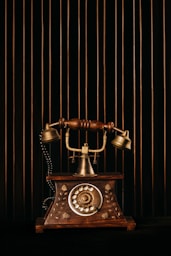 black and gold rotary phone