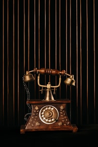 black and gold rotary phone