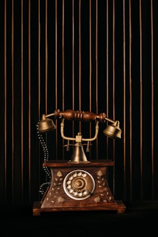 black and gold rotary phone