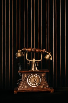 black and gold rotary phone